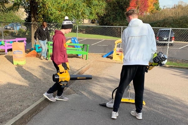 Westside Christian Students helping with landscape maintenance at a school